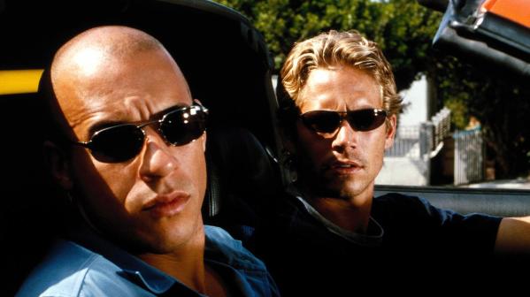 Dominic Toretto (Vin Diesel) and Brian O'Connor (Paul Walker) fasten their seatbelts in the first film of the popular "Fast and Furious" franchise